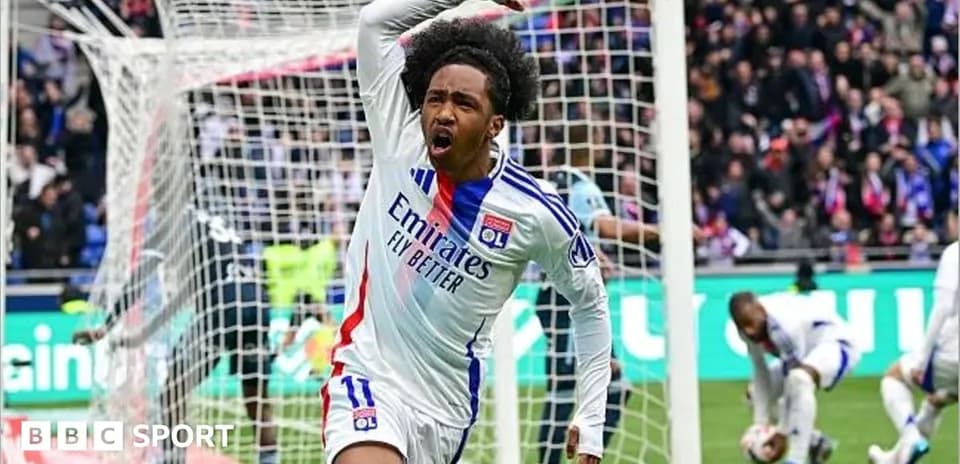 Player celebrating a goal in stadium with crowd