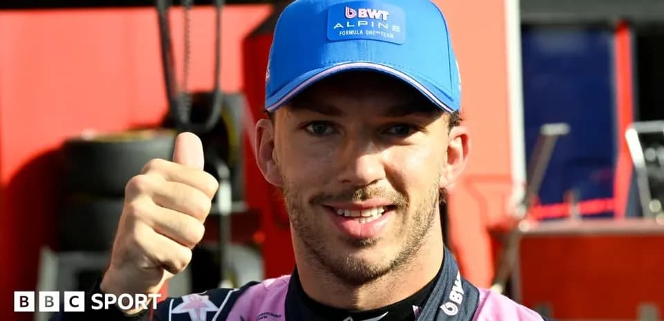 Driver giving thumbs up in team attire