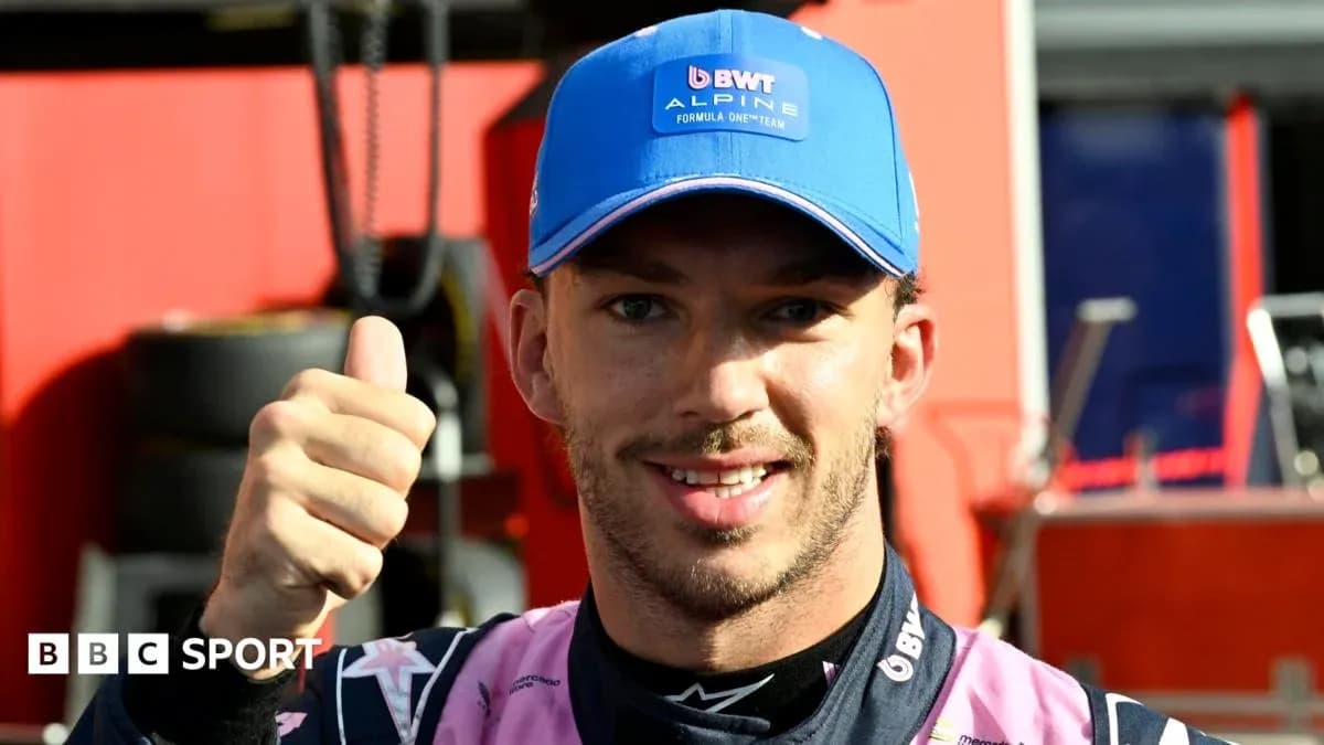 Driver giving thumbs up in team attire