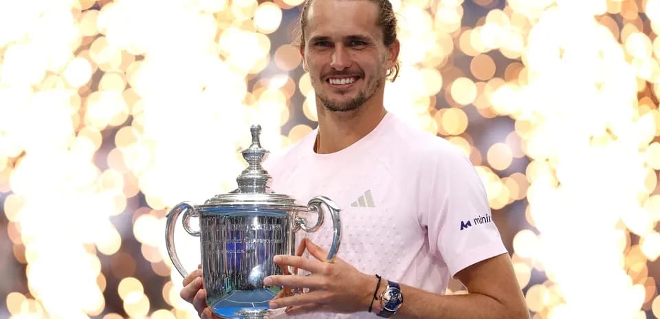 Player holding trophy with sparkling background