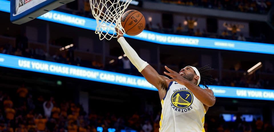 Player dunking the basketball during a game