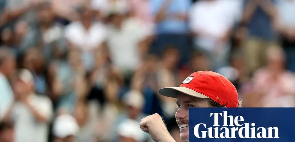 Player celebrating with raised fist in crowd