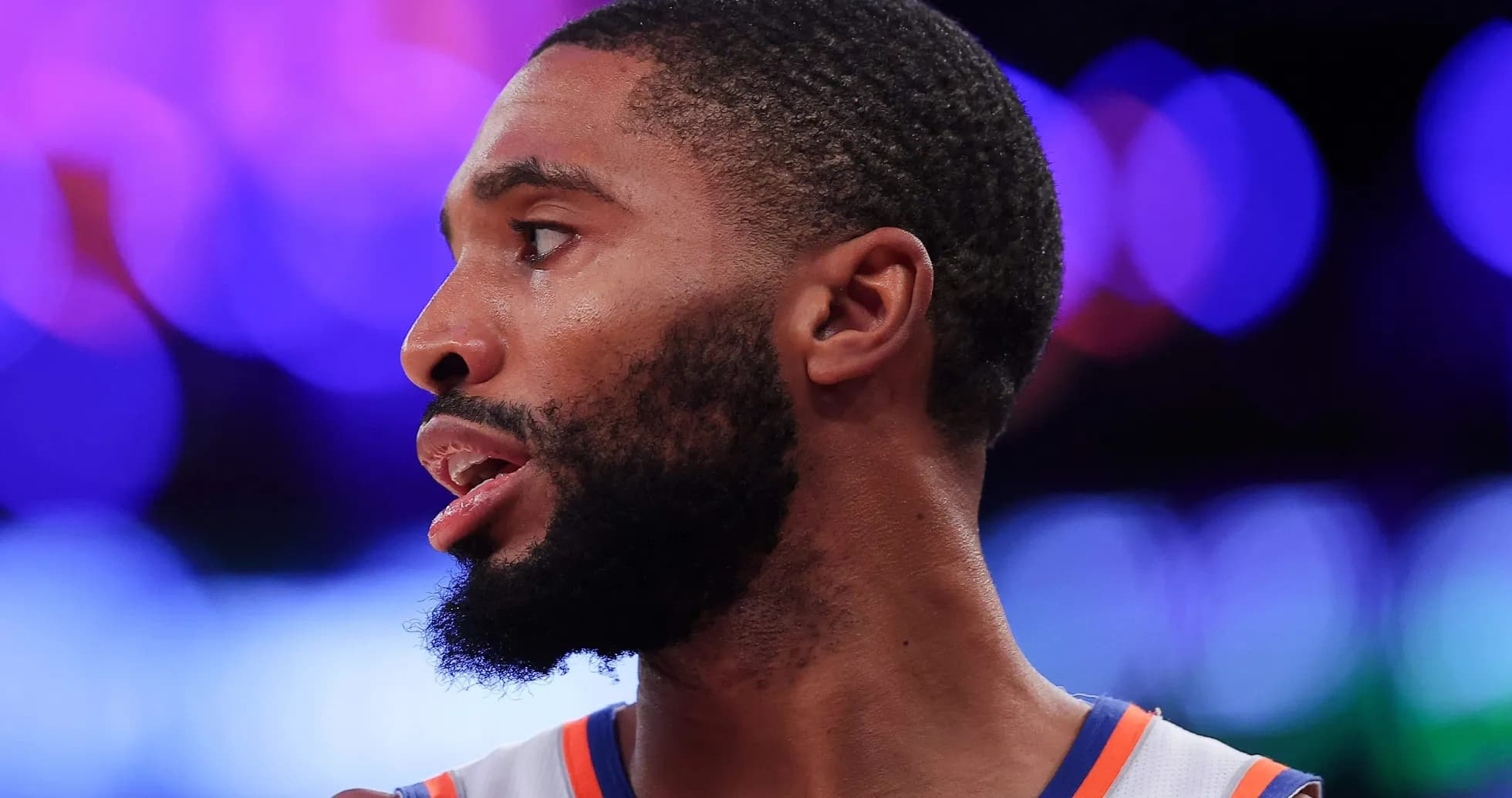 Basketball player in profile during game