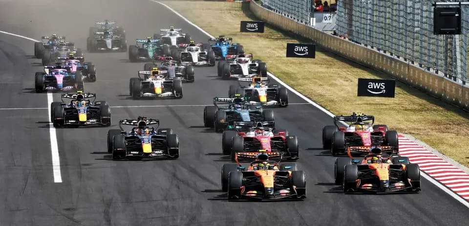 Formula 1 cars racing at the start of the race