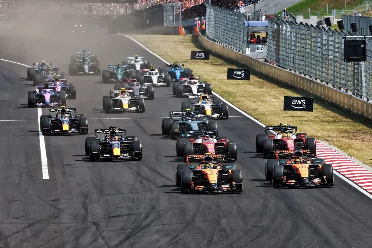 Formula 1 cars racing at the start of the race