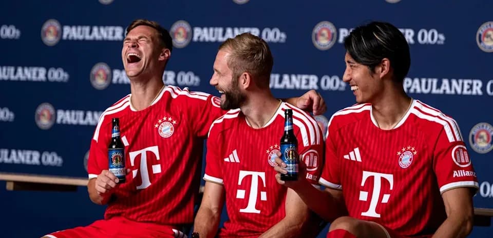 Three Bayern Munich players posing with drinks