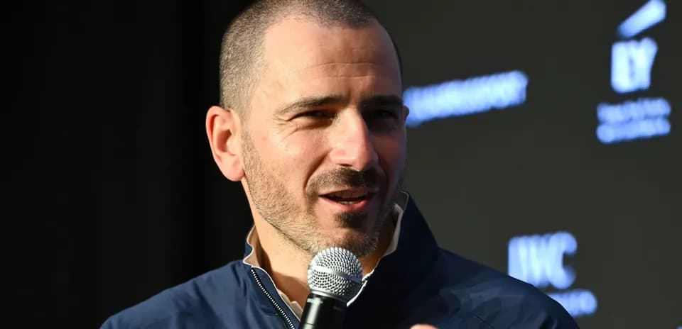 Person speaking into microphone at event