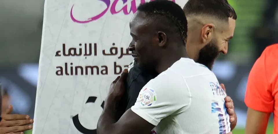 Players embracing after a match celebration