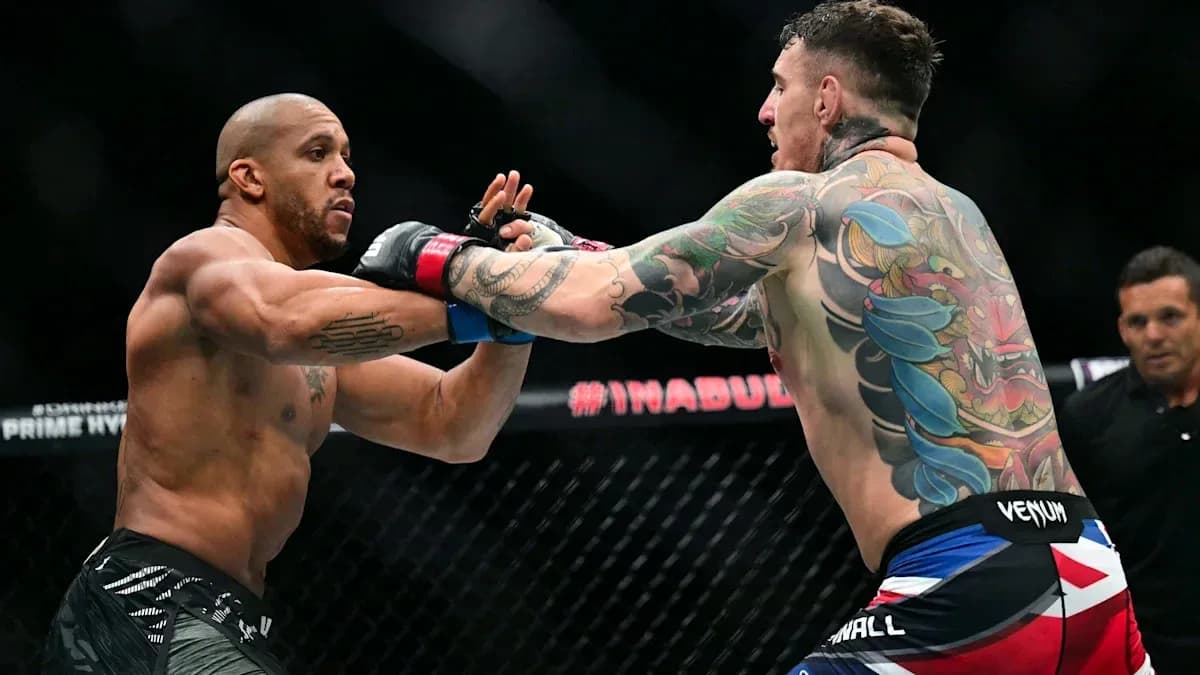Two fighters exchanging punches in octagon match