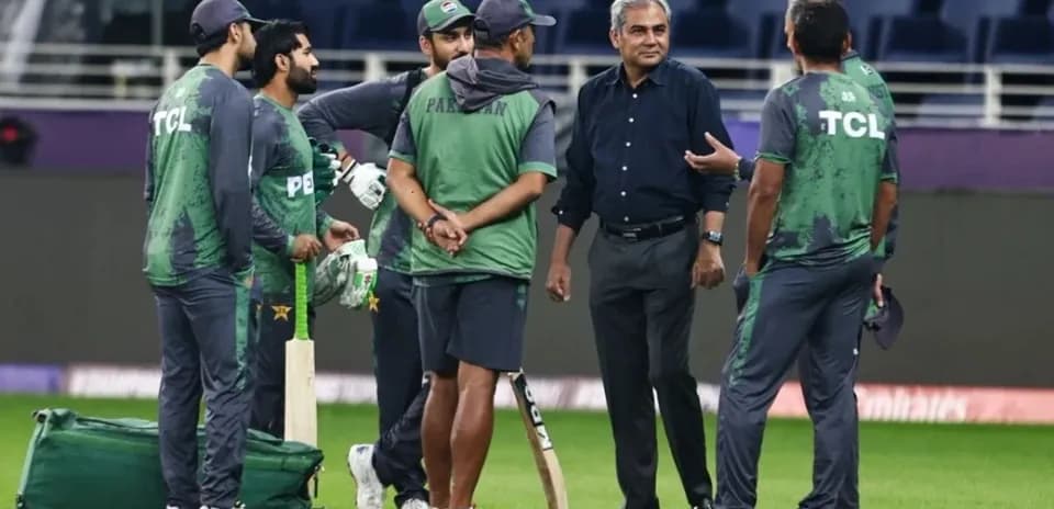 Pakistan cricket team discussing strategies on field