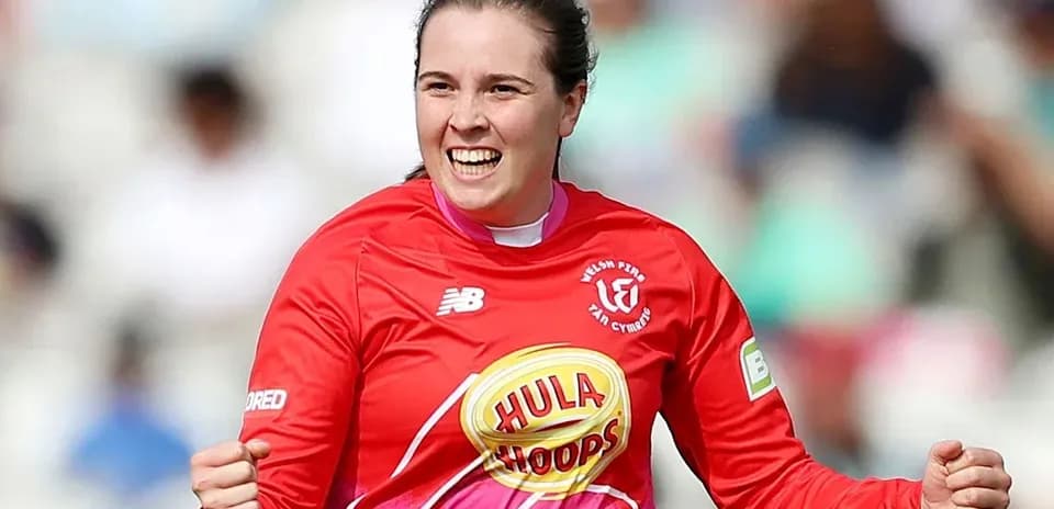 Goalkeeper celebrating during a match in red uniform
