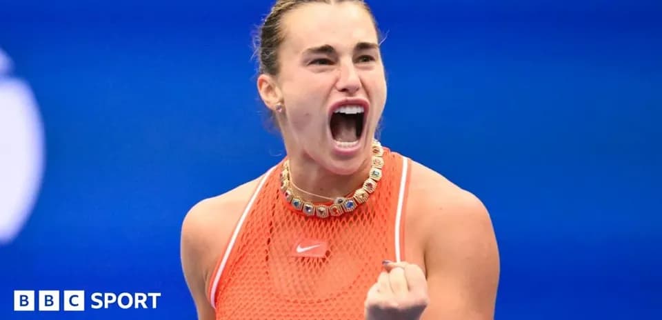 Tennis player celebrating victory with a fist pump
