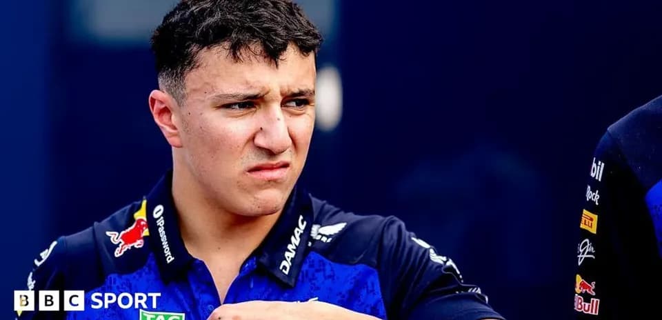 Driver in team uniform during paddock interview