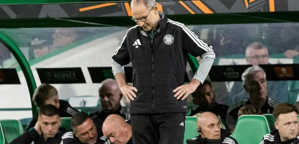 Manager with head down on team bench during match