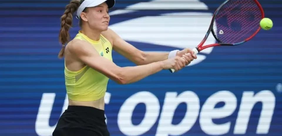 Player hitting a tennis ball during US Open match