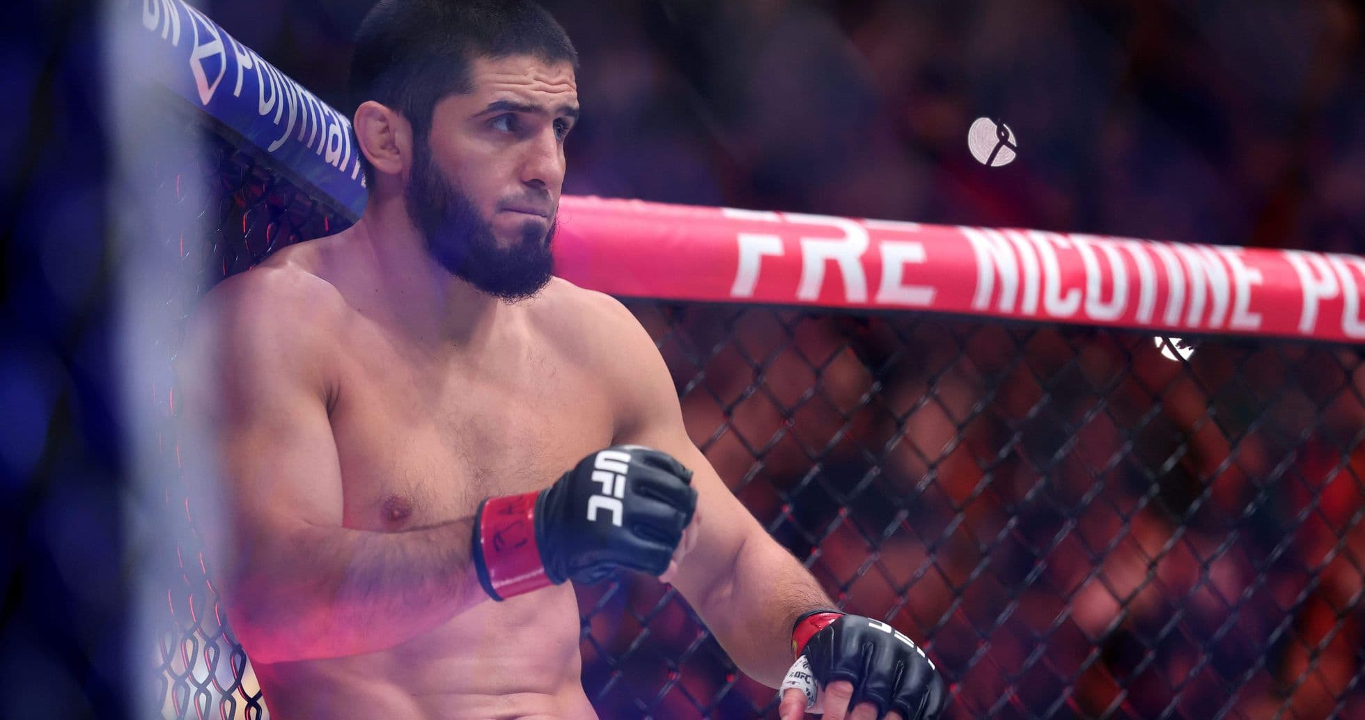 Fighter sitting in the UFC octagon between rounds
