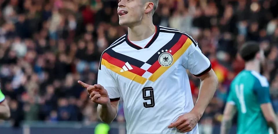German player celebrating after scoring a goal