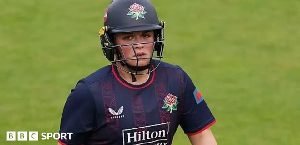 Cricketer wearing helmet during match on field