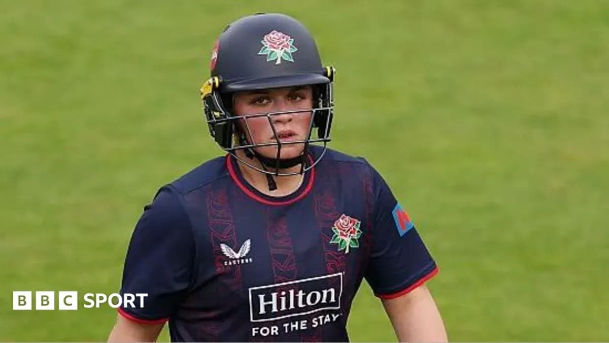 Cricketer wearing helmet during match on field