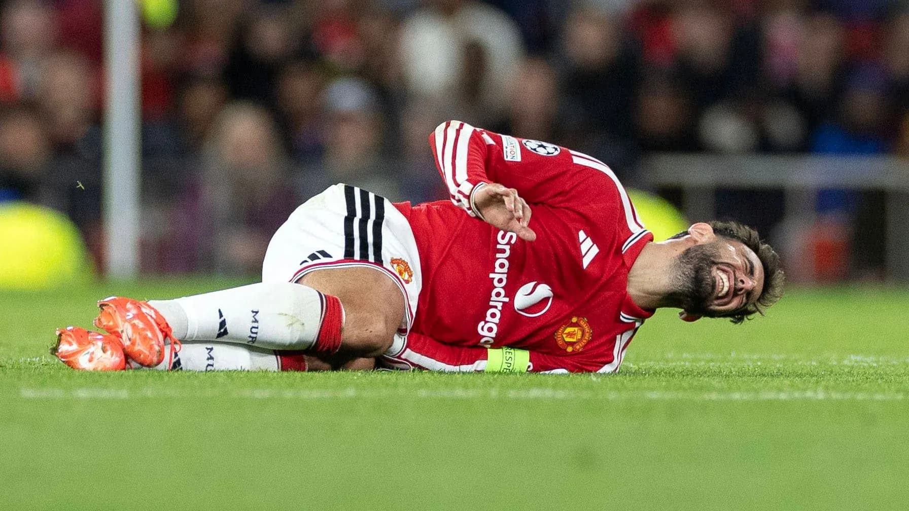 Player lying on the ground, injured during match