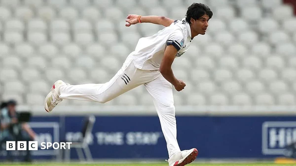 Bowler delivering a ball during cricket match