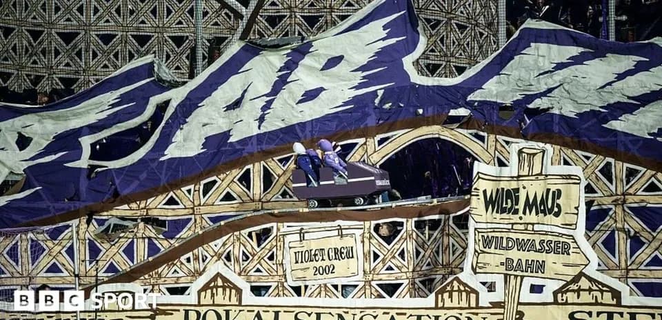 Fan banner depicting a roller coaster in stadium
