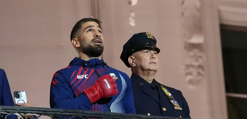 Fighter and police officer during national anthem ceremony