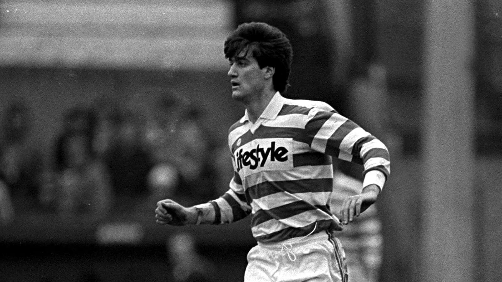 Player in striped jersey running on the field