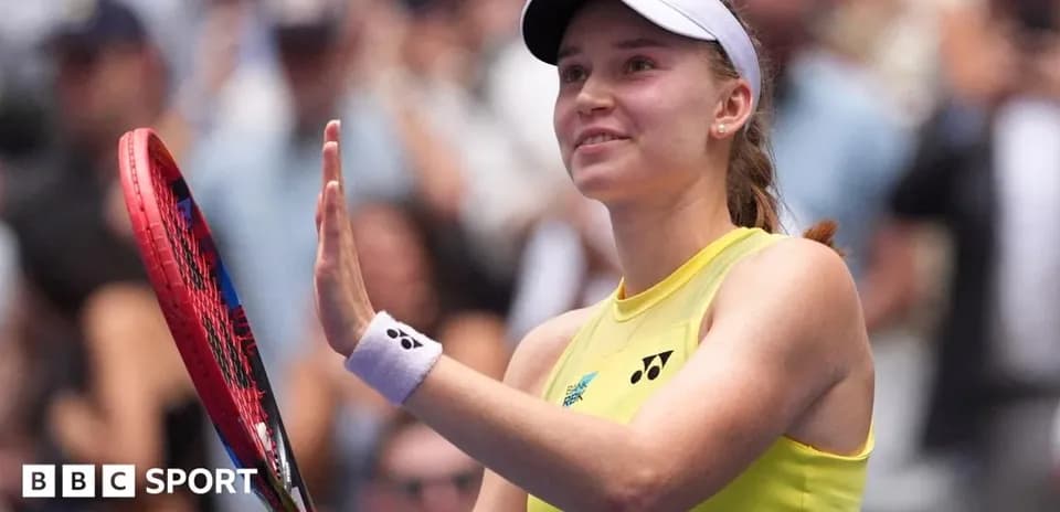 Tennis player waving with racket after match