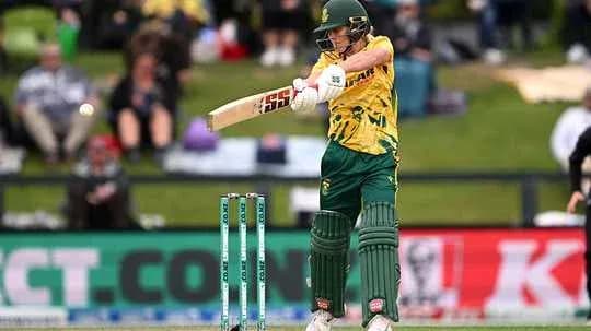 Batter playing a shot in a cricket match