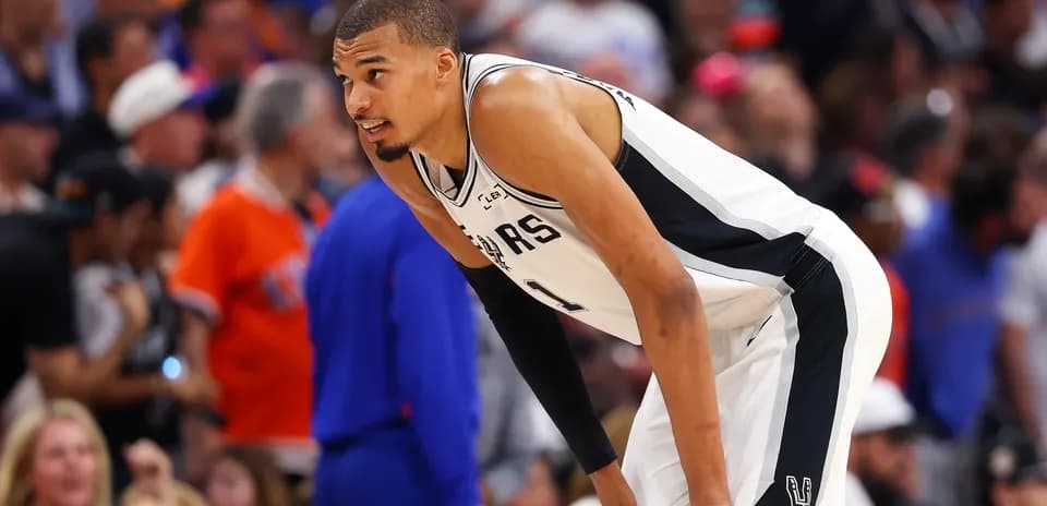 Player bending over during basketball game on court