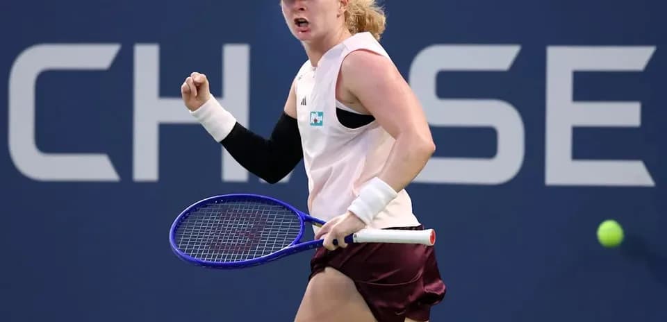 Tennis player celebrating after winning a point