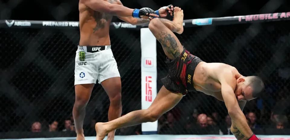 Fighter executing a takedown in UFC match