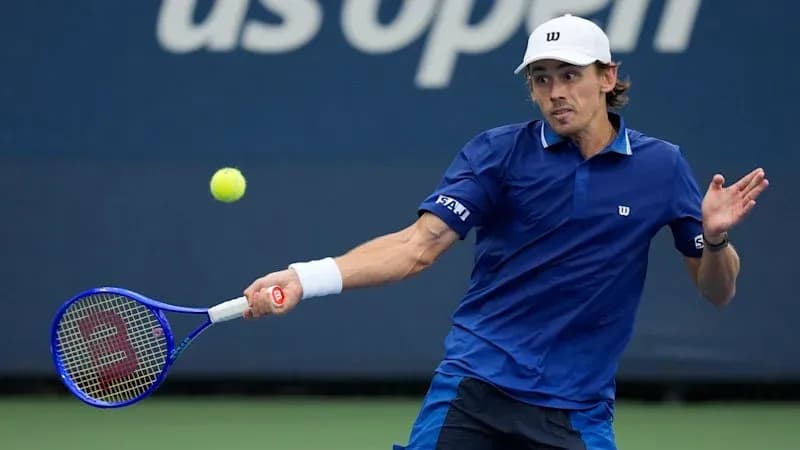 Player hitting a backhand shot at US Open