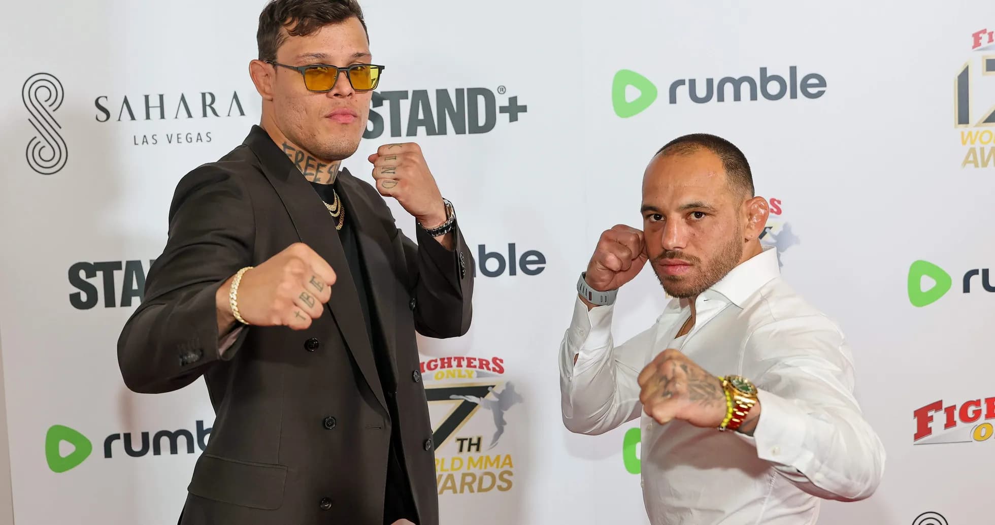 Two fighters posing at the MMA Awards event
