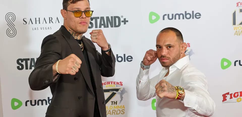 Two fighters posing at the MMA Awards event