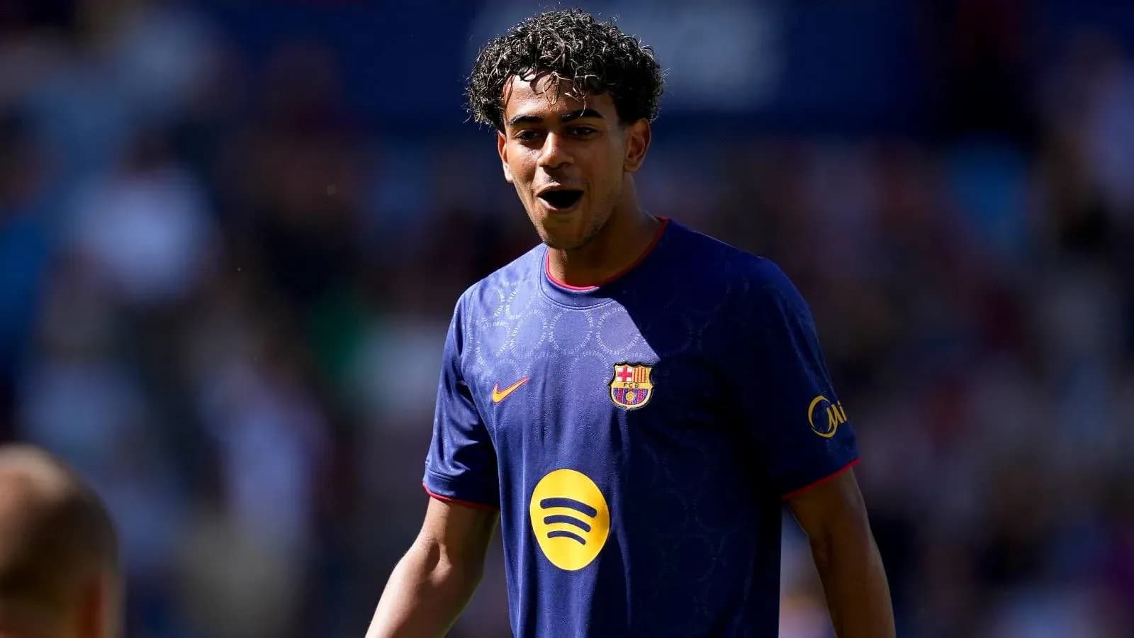 Player celebrating in Barcelona jersey on field