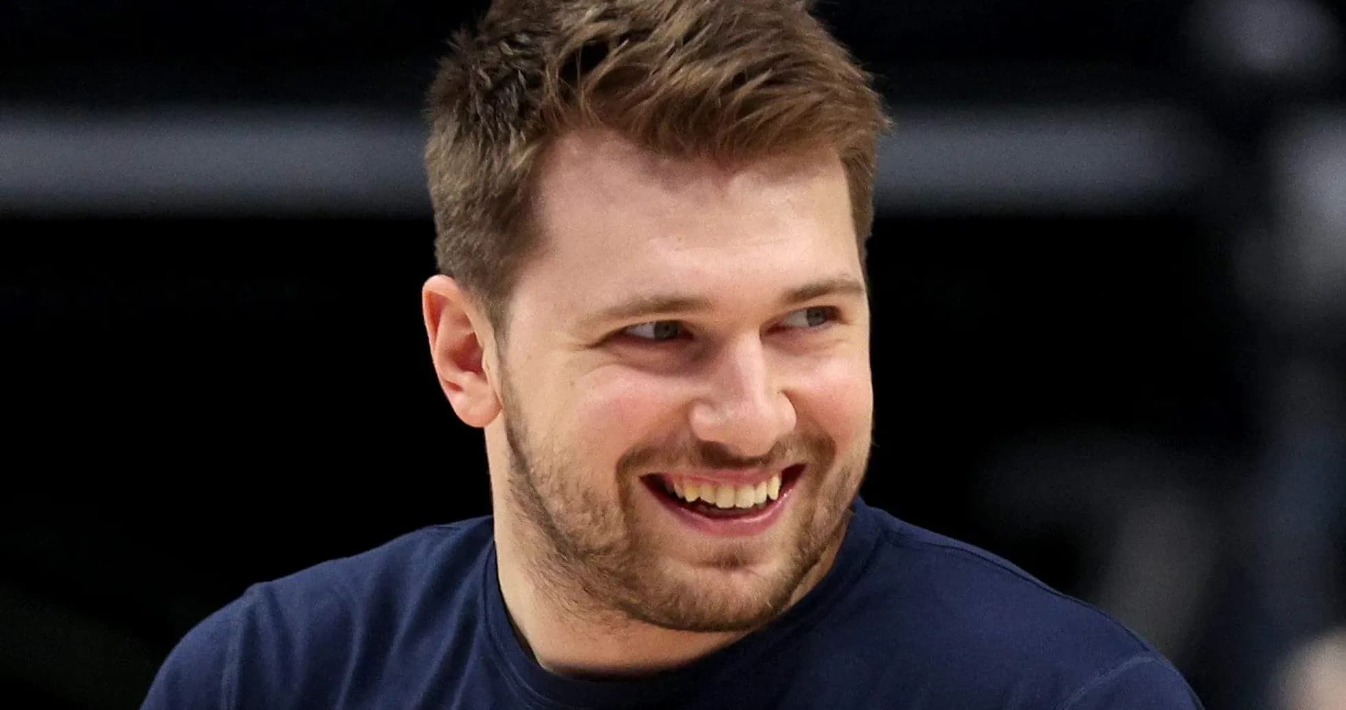 Player smiling during basketball warm-up session