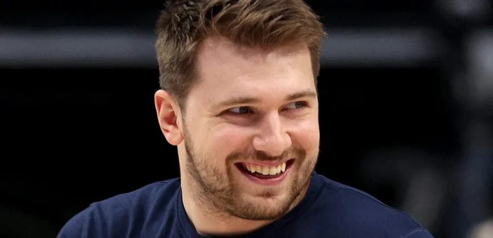 Player smiling during basketball warm-up session