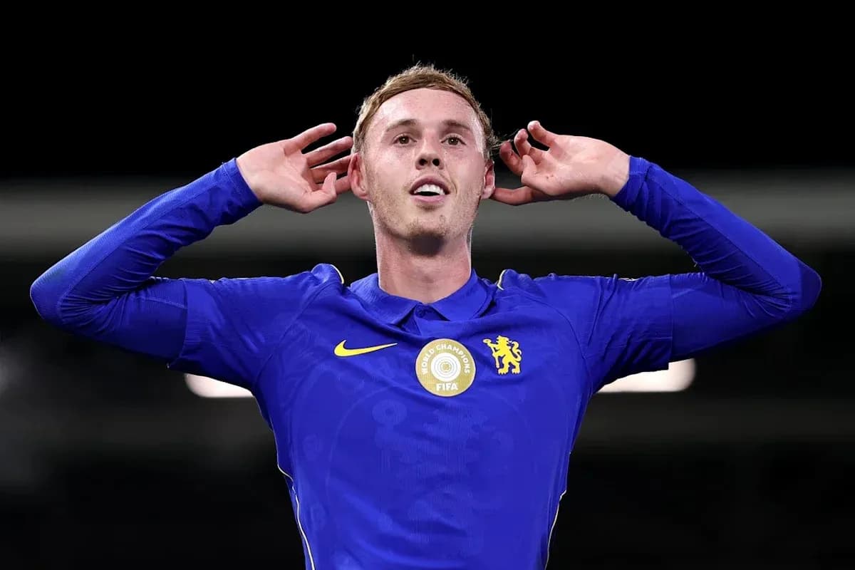 Player celebrating with hands on ears in blue jersey