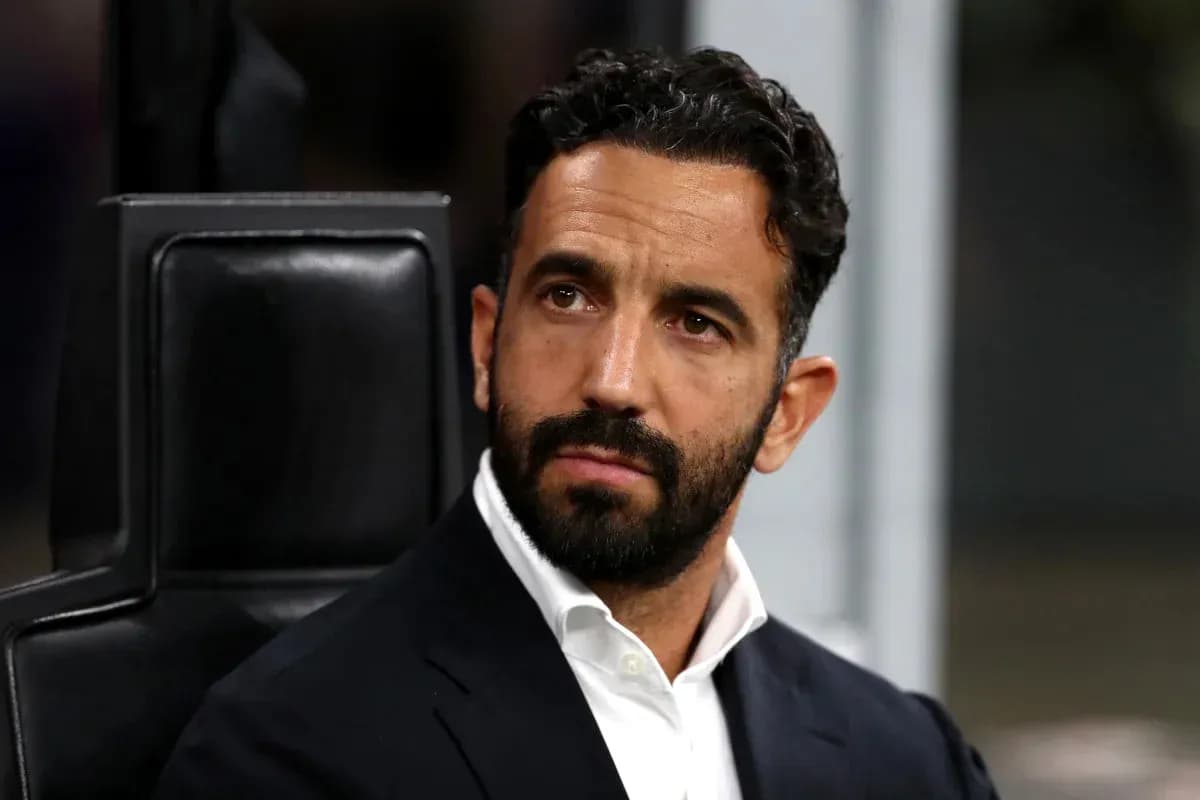 Coach seated on bench during a match