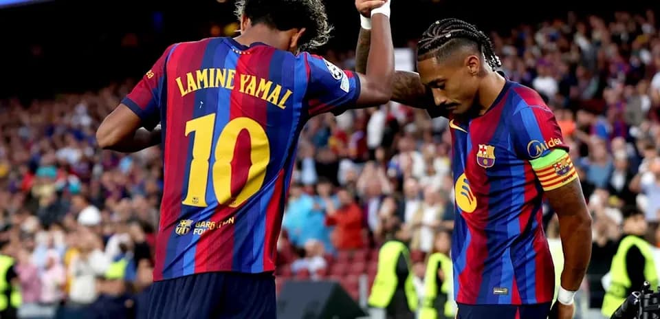 Lamine Yamal and teammate celebrating during match