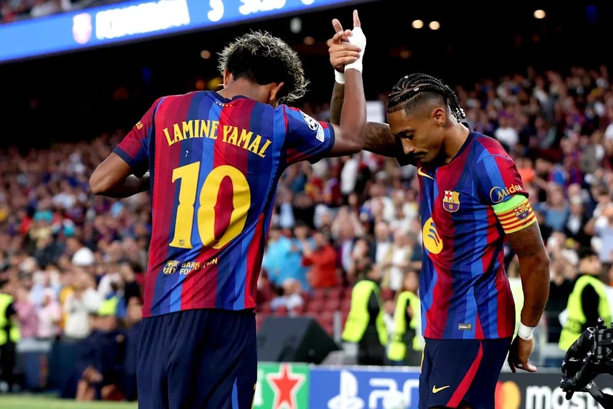 Lamine Yamal and teammate celebrating during match