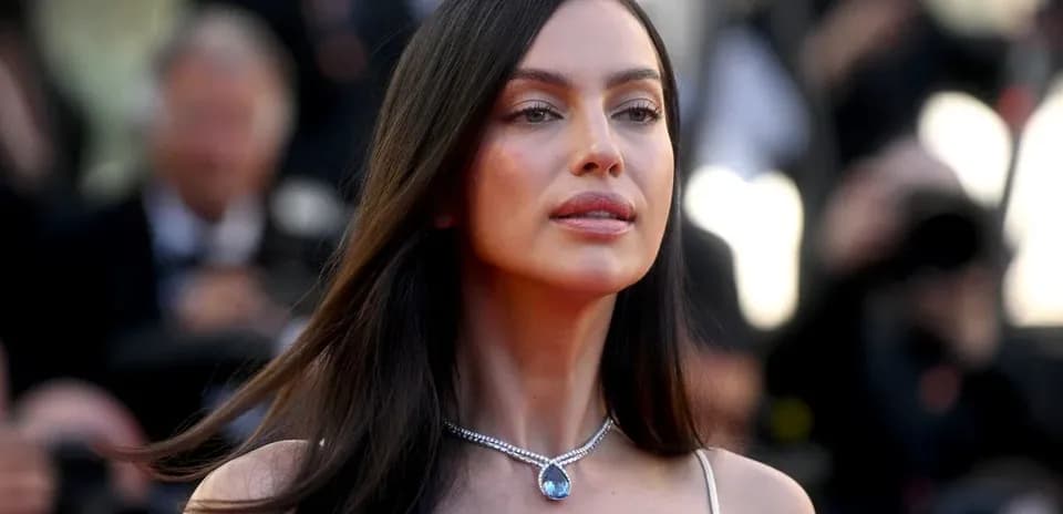 Woman with long hair wearing a necklace at event
