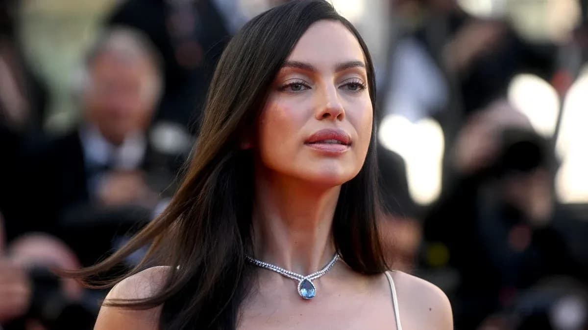 Woman with long hair wearing a necklace at event