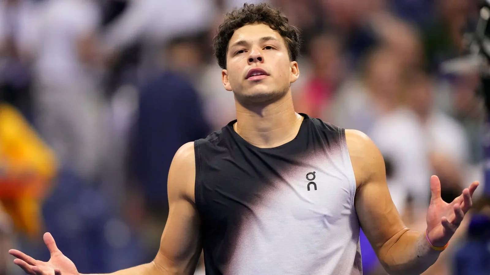 Tennis player gesturing during a match