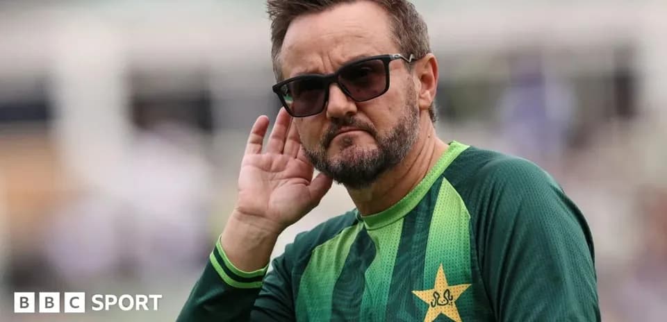 Cricket coach listening during training session