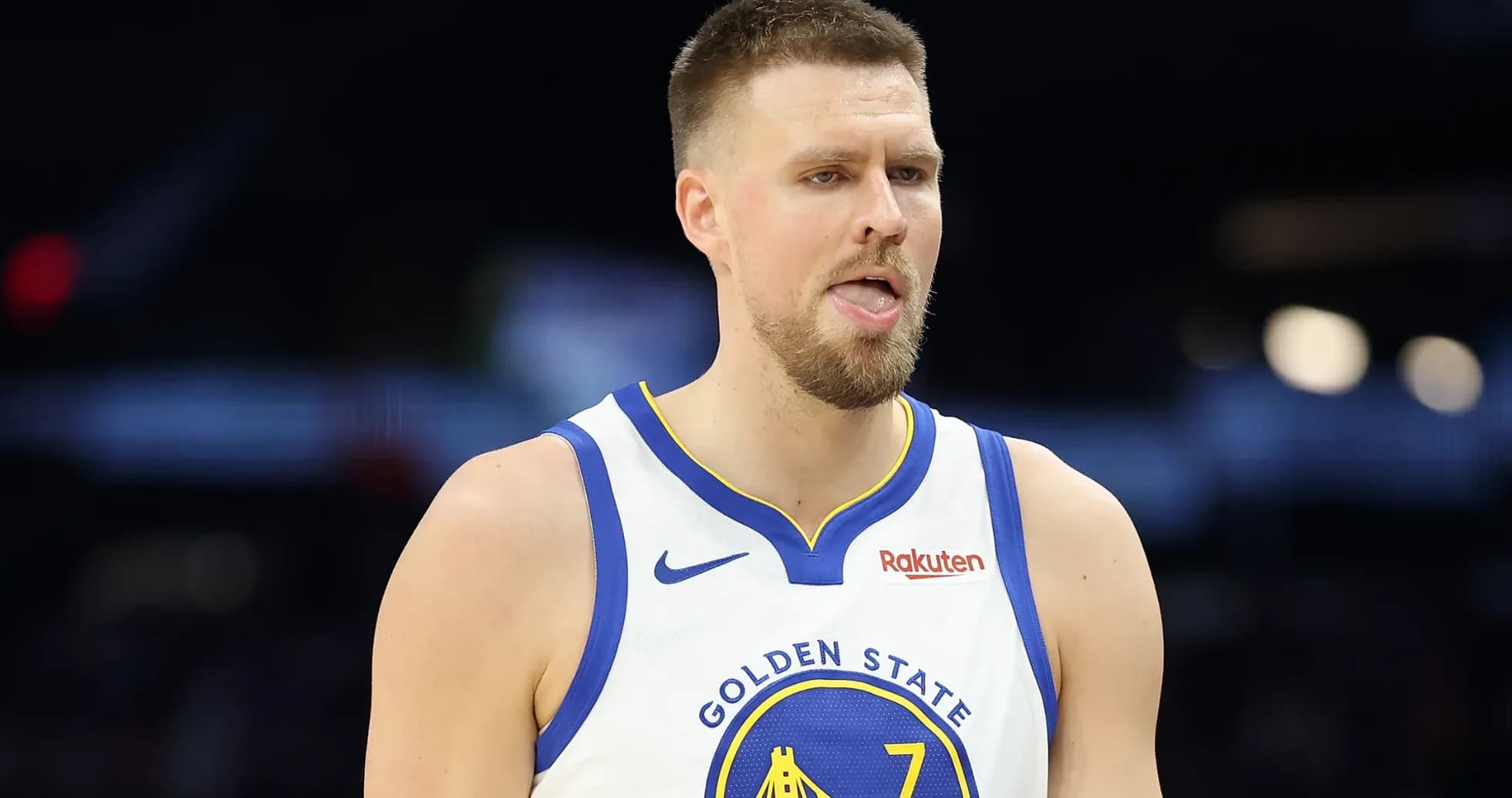Player in Golden State Warriors jersey on court