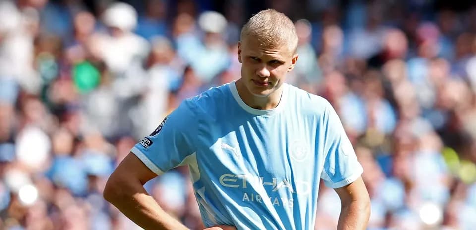 Player in light blue jersey during match at stadium