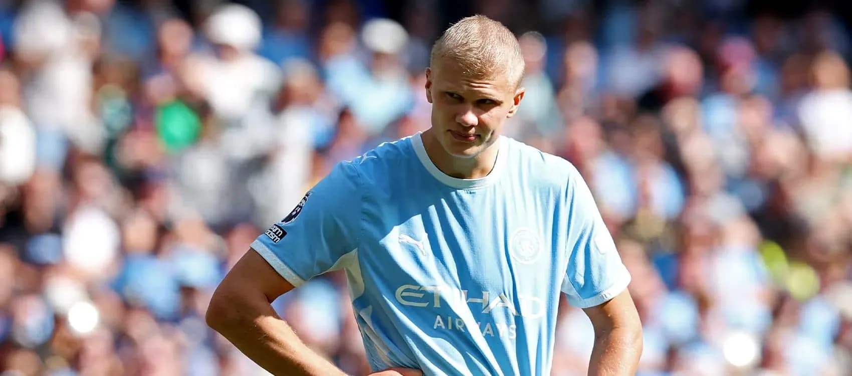 Player in light blue jersey during match at stadium